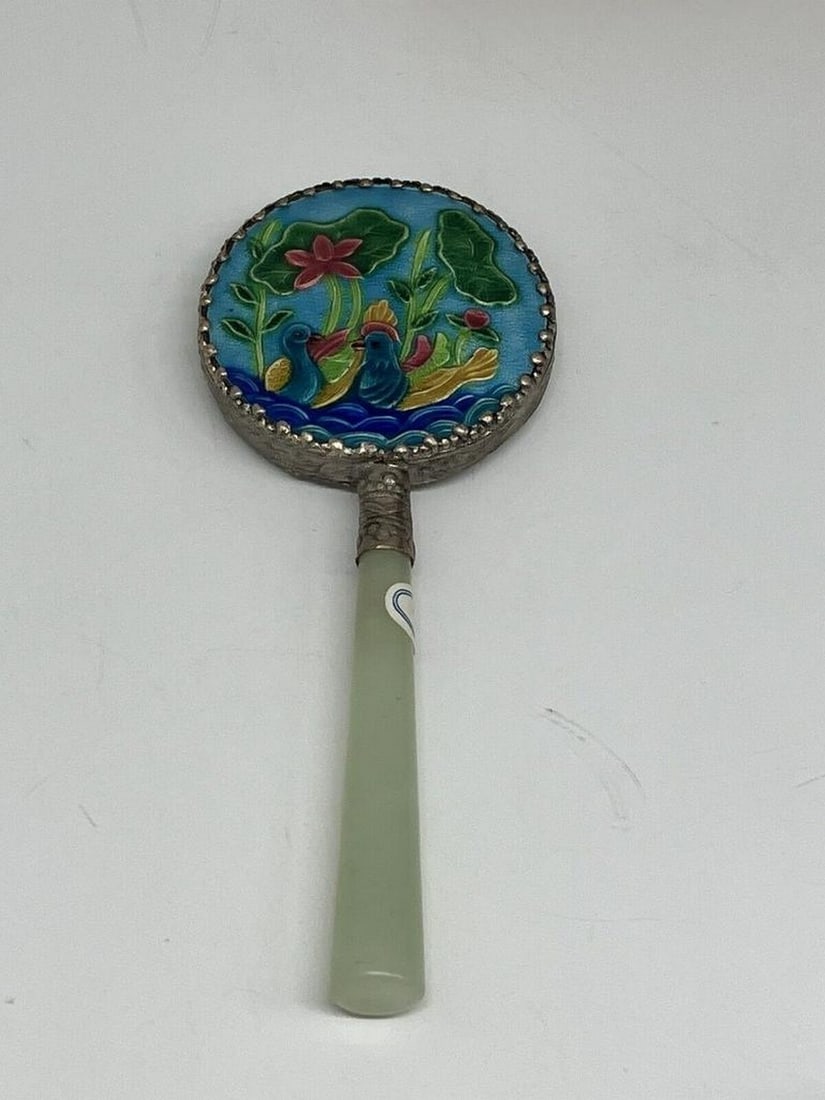 Vintage Chinese Silver And Floral Design Hand Mirror With Jade Handle: Vintage Chinese Silver And Floral Design Hand Mirror With Jade Handle This vintage Chinese hand mirror features a silver frame adorned with an intricate floral design in vibrant colors. The handle
