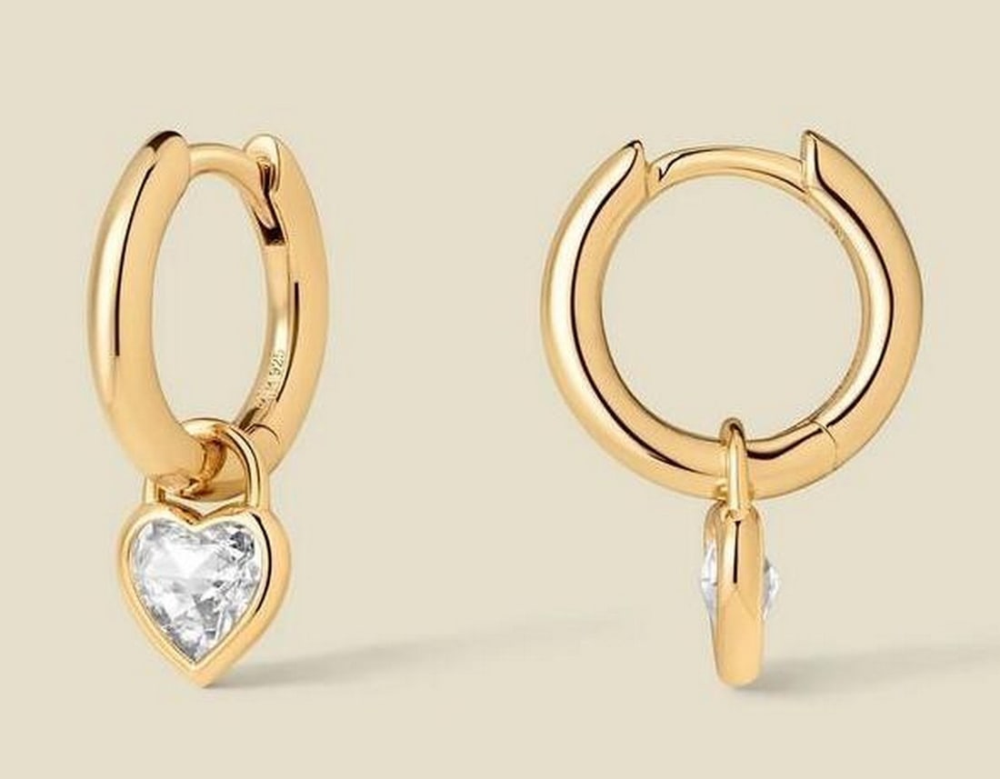 Gold Vermeil CZ Heart Hoop Earrings: Gold Vermeil CZ Heart Hoop Earrings These gold vermeil hoops feature a delicate heart-shaped cubic zirconia that catches the light with every movement, adding a subtle, romantic touch. Lightweight and