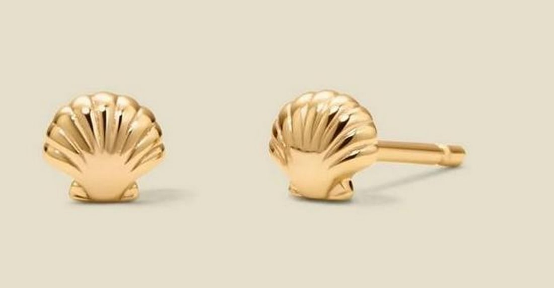 Fan-Shaped Shell Stud Earrings Gold Vermeil: Fan-Shaped Shell Stud Earrings Gold Vermeil A pair of small fan-shaped stud earrings featuring a subtle textured surface that catches light softly. Finished in gold vermeil, these earrings measure