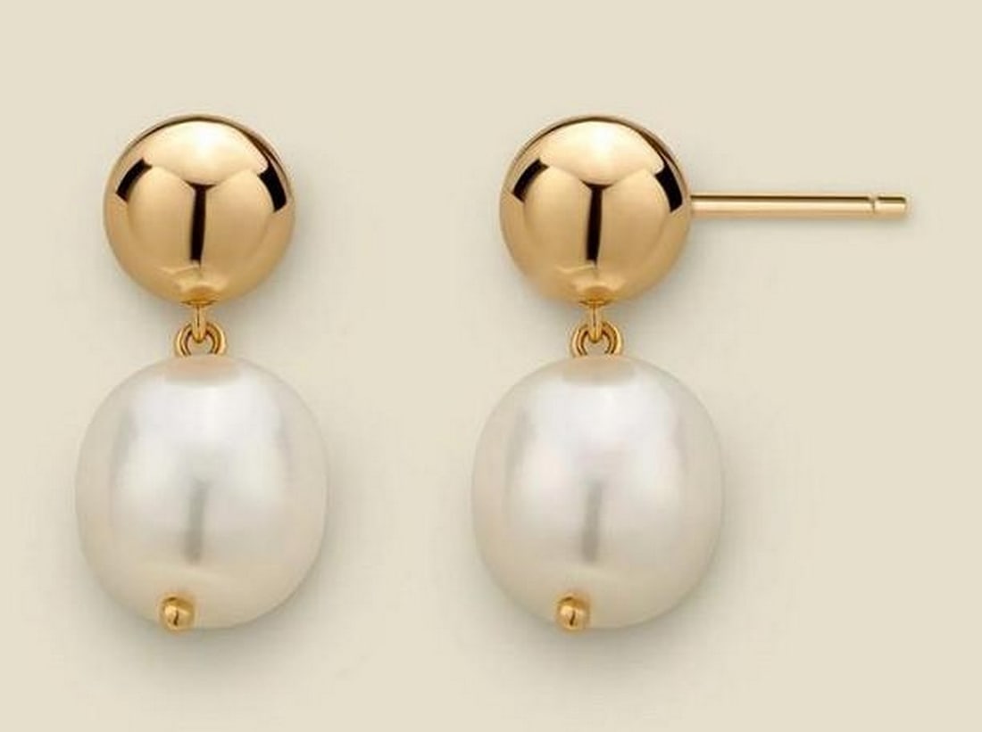 Gold Vermeil Baroque Pearl Drop Earrings: Gold Vermeil Baroque Pearl Drop Earrings Stud earrings combining a polished 7mm gold vermeil sphere with a natural 10mm baroque pearl drop. The design pairs classic elegance with subtle asymmetry, su