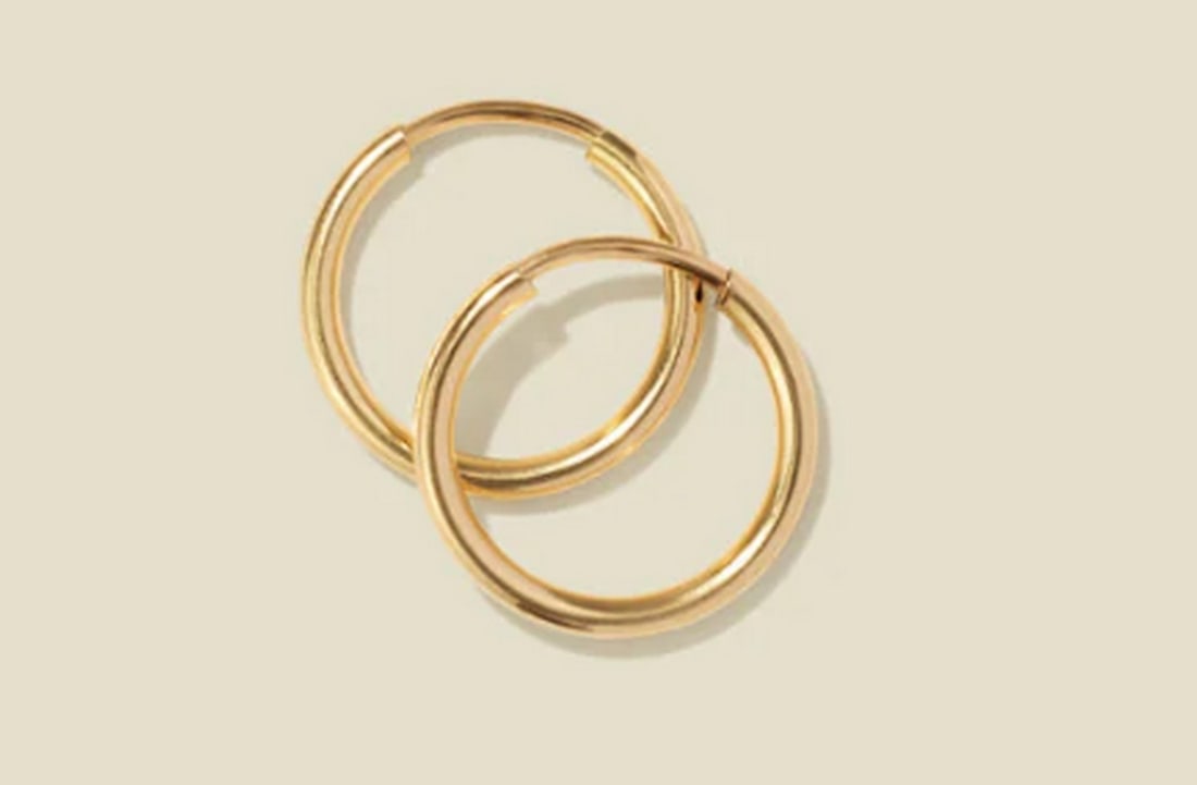 14k Gold Filled Live In Hoop Earrings: 14k Gold Filled Live In Hoop Earrings Effortlessly stylish and endlessly durable, these infinity-style hoops add a lustrous touch without the hassle. Designed for all-day wear and night-long