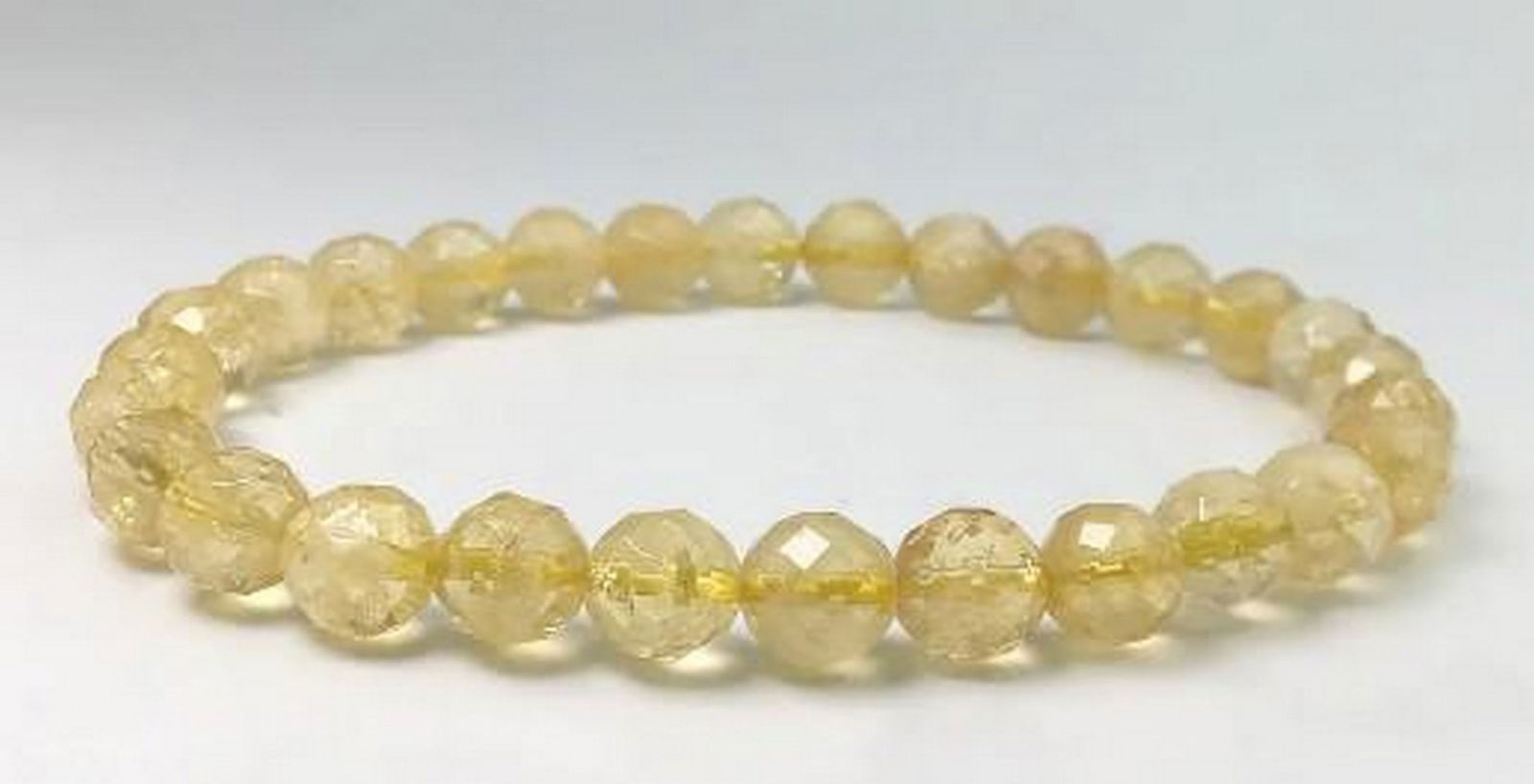 Citrine Glow Faceted Bracelet: Citrine Glow Faceted Bracelet The Citrine Glow Faceted Bracelet showcases the brilliant golden hues of citrine, expertly faceted to reflect light with every movement. Known for its vibrant energy,