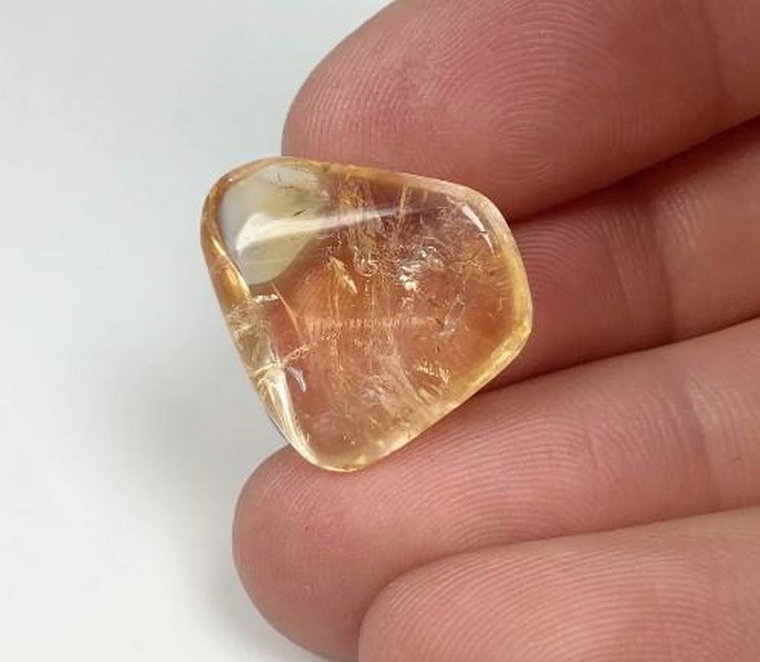 Golden Citrine Tumble: Golden Citrine Tumble This Golden Citrine Tumble features the warm, radiant hues of citrine, known for its uplifting and energizing properties. With its smooth, polished surface, this tumble stone