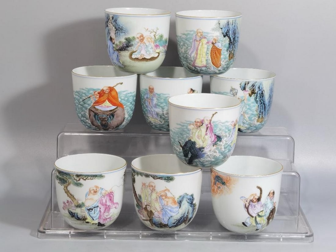 Set of 18 Enameled Cups Featuring the Eighteen Arhats: Set of 18 Enameled Cups Featuring the Eighteen Arhats This visually striking set of enameled porcelain cups showcases the Eighteen Arhats (enlightened disciples of the Buddha) each meticulously depic