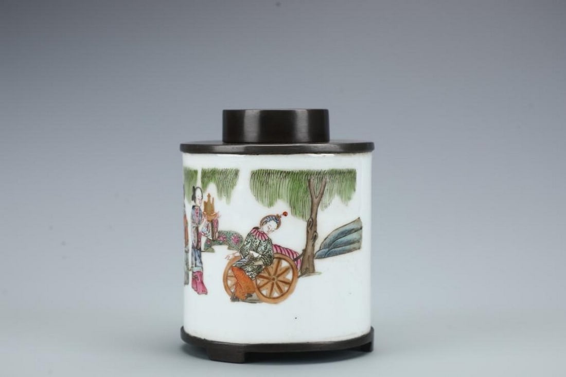 Old Tin Porcelain Figurine Tea Can: Old Tin Porcelain Figurine Tea Can This charming old tin porcelain figure tea can features a vivid scene of people engaged in lively conversation, gathered together and sharing objects in hand,