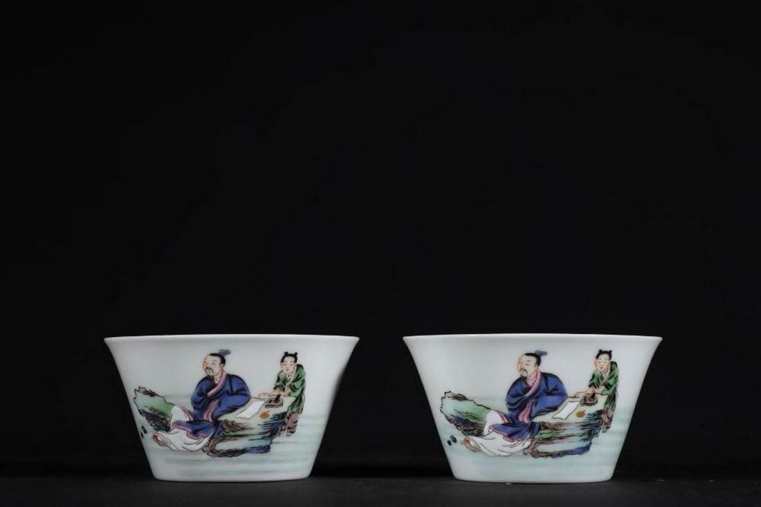 Pair Of Yongzheng Famille Rose Horseshoe Cups With Figures: Pair Of Yongzheng Famille Rose Horseshoe Cups With Figures. A stunning pair of horseshoe-shaped cups delicately adorned with vibrant famille rose enamel depicting intricate figure scenes inspired from