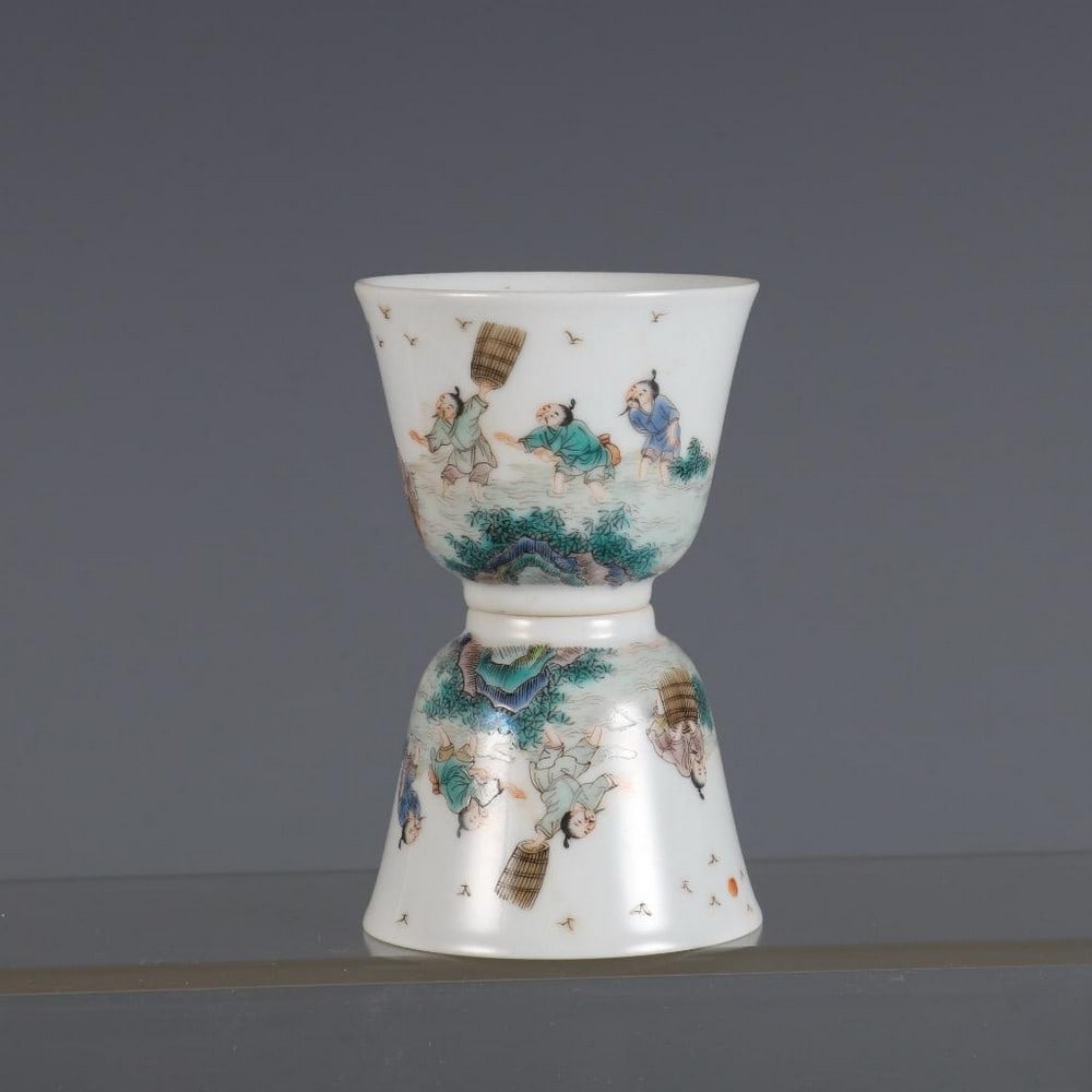 Inspired Qing Tongzhi Famille Rose Bell Cups Depicting Fisherman and Musical Scene: Inspired Qing Tongzhi Famille Rose Bell Cups Depicting Fisherman and Musical Scene This inspired pair of Qing Dynasty Tongzhi-era bell cups is beautifully decorated with famille rose enamels. The intr