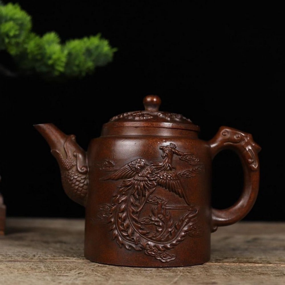 Antique Chinese Copper Dragon & Phoenix Teapot: Antique Chinese Copper Dragon & Phoenix Teapot The antique copper kettle features an intricate design of a dragon and phoenix, symbolizing power and harmony in traditional Chinese culture. Craft