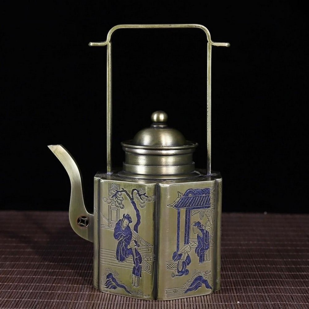 Antique Chinese White Copper Teapot: Antique Chinese White Copper Teapot This white copper teapot features a detailed depiction of a small, bustling Chinese village. The intricately etched design captures scenes of daily life, with fig