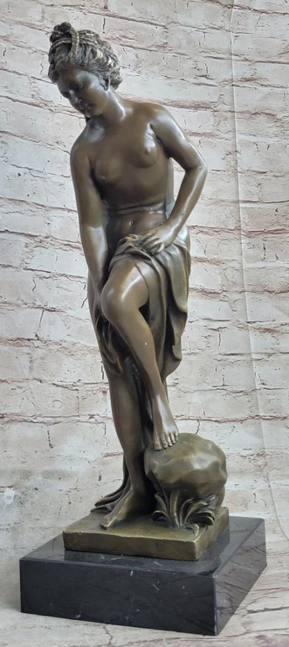 Solitude and Grace" Bronze Nymph Sculpture by Jean Patoue - 16" x 6: "Solitude and Grace" Bronze Nymph Sculpture by Jean Patoue - 16" x 6" This captivating bronze statue evokes the image of a nymph, pausing to bask in the sun before returning to the wat