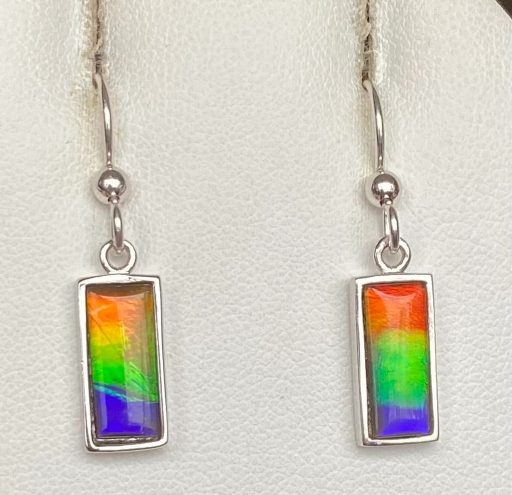 Multi-colour Ammolite Earrings: Multi-colour Ammolite Earrings These earrings feature 12mm x 5mm low-dome quartz-capped triplets set in rhodium-plated sterling silver for a tarnish-resistant finish. Hanging from matching rhodium-p