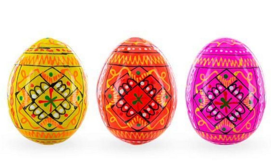 Sunburst Trio, Hand-Painted Ukrainian Eggs: Sunburst Trio, Hand-Painted Ukrainian Eggs. Brighten your space with this radiant set of 3 hand-painted Ukrainian pysanky wooden eggs in warm hues of yellow, pink, and orange. Each egg features