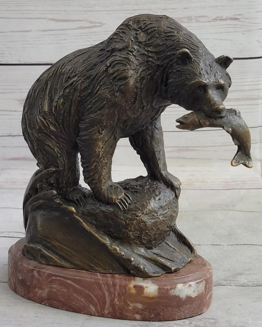 Bear Clutching Salmon Original Bronze Statue - 9" x 7.5": Bear Clutching Salmon Original Bronze Statue - 9" x 7.5" Capture the raw power and grace of nature with this original bronze statue. Depicting a bear in the act of clutching a salmon, the scu