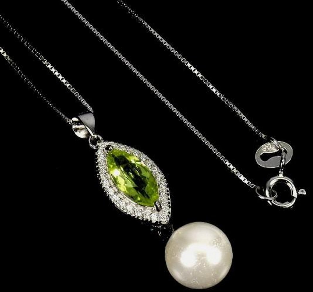 Sterling Silver Marquise Peridot & Mother of Pearl Necklace: Sterling Silver Marquise Peridot & Mother of Pearl Necklace This elegant necklace showcases a 10x5mm marquise-cut peridot set in polished 925 sterling silver, accented with luminous mother of pea