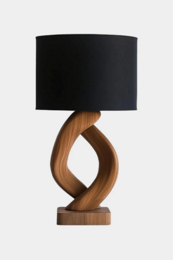 Twisted Loop Wooden Table Lamp: Twisted Loop Wooden Table Lamp Bold and sculptural, this handcrafted table lamp features a gracefully twisted wooden base that forms a fluid loop, showcasing rich grain and warm tones. Resting on a