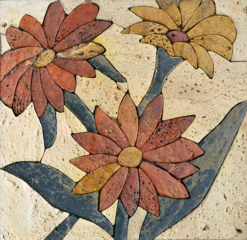 Trioflo Mosaic Wall Art: Trioflo Mosaic Wall Art A handcrafted mosaic design made from natural stone. The piece features a floral-inspired motif created by carefully cutting and arranging individual stone tiles, resulting in