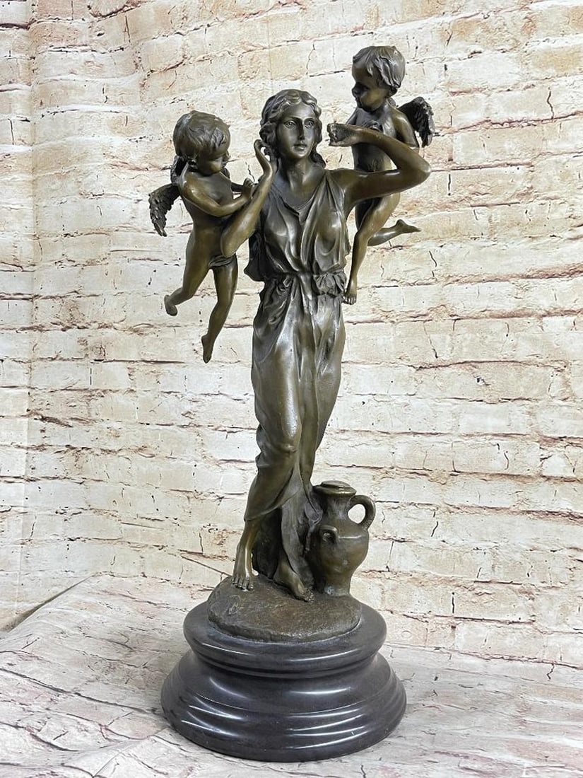 Young Lady Complimented By Two Cherubs Bronze Sculpture - 35lbs: This delightful piece depicts a woman standing by a water jug with two cherubs flying by her head. She holds her hands up to her ears as each cherub looks to her as if they are about to say something.