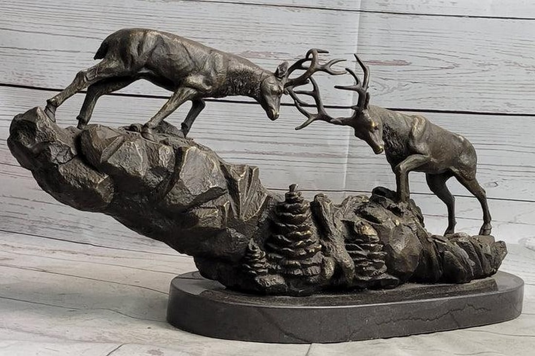 Wilderness Clash Dueling Red Deer Stag Bronze Art Sculpture on Marble Base - 10" x 20": Wilderness Clash Dueling Elk Caribou Deer Stag Bronze Art Sculpture on Marble Base - 10" x 20" Behold the captivating allure of this bronze sculpture that portrays two Red Deer stags locked in