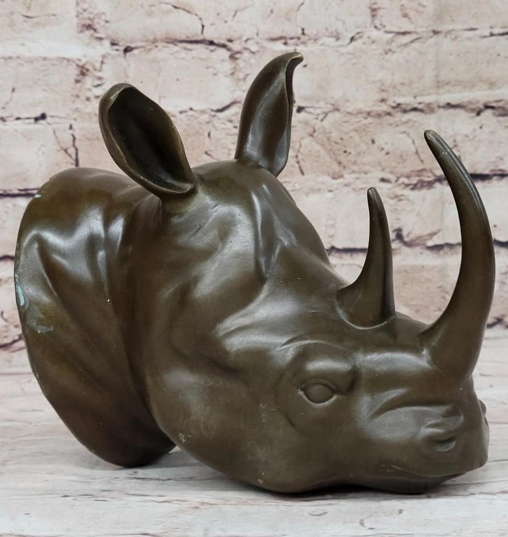 Compact Rhinoceros Head Original Bronze Sculpture by Thomas - 7" x 7": Compact Rhinoceros Head Original Bronze Sculpture by Thomas - 7" x 7" This compact rhinoceros head sculpture, meticulously crafted by artist Thomas using the lost wax method, captures the maj