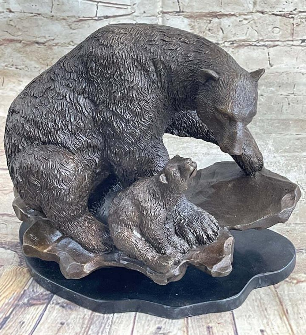 Majestic Bronze Polar Bear and Cub Statue for Elegant Decor - 10" x 14": In this sculpture, a young bear gazes upward at its mother, capturing the poignant bond between a mother and her cub. The maternal figure serves as both protector and nurturer, imparting strength and