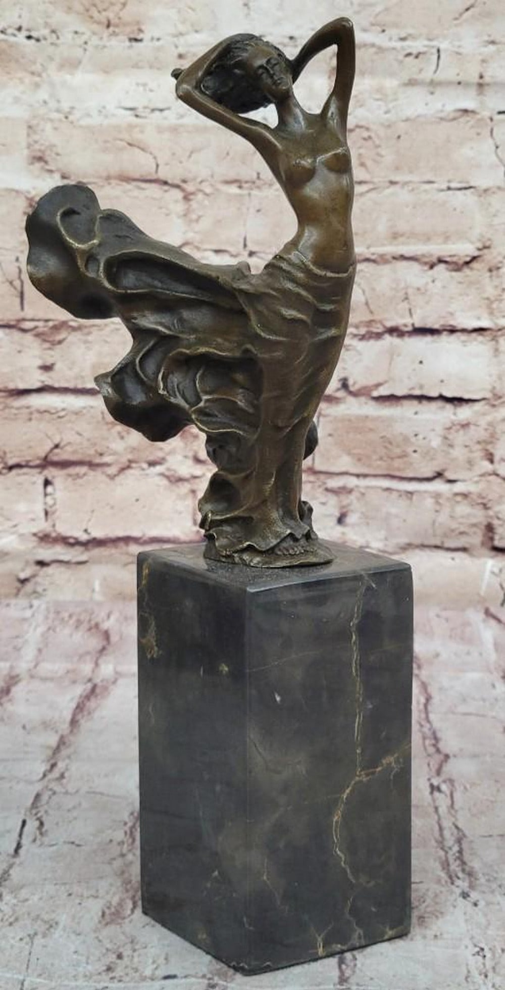 Whispers of the Wind Bronze Reproduction Sculpture: Whispers of the Wind Bronze Reproduction Sculpture This exquisite bronze reproduction captures a fleeting moment of natural beauty, where a young woman stands in serene motion, her nude form elegantl