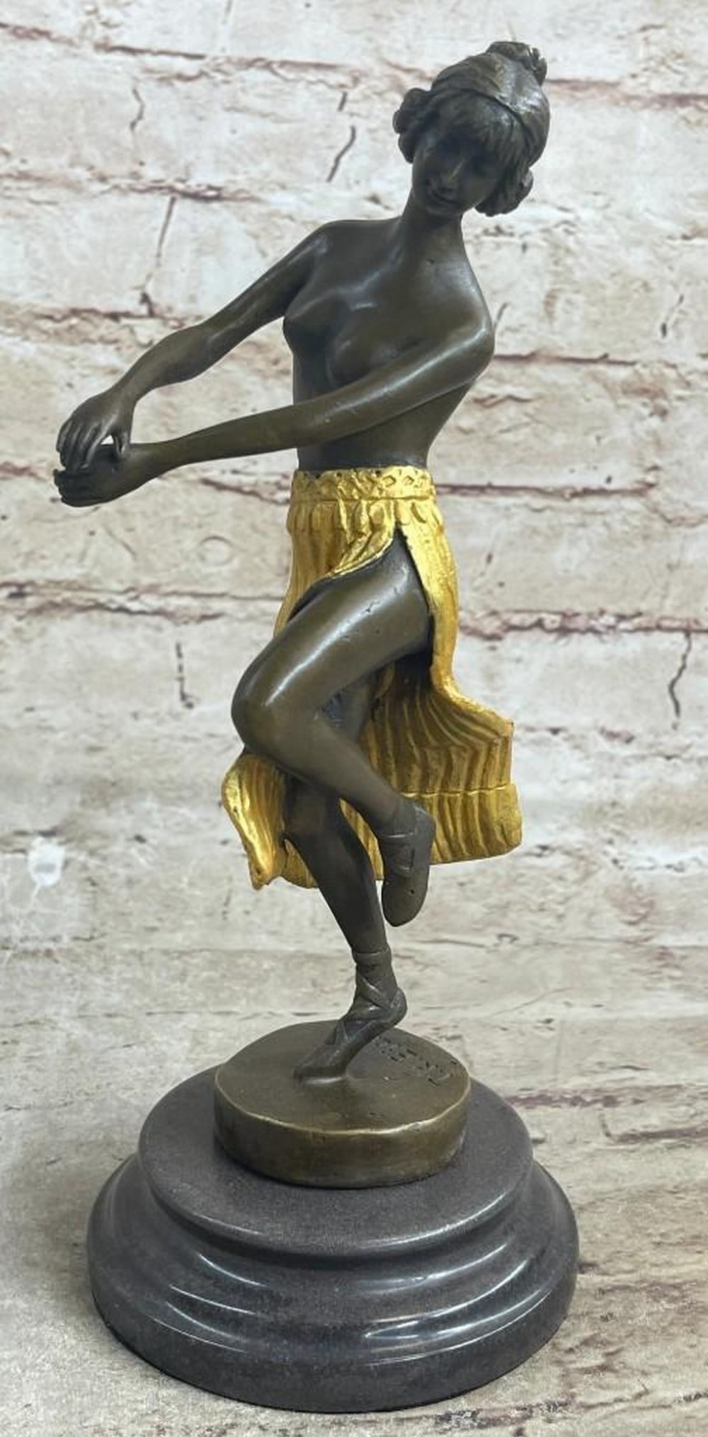 Hula’s Grace Bronze Reproduction Sculpture: Hula’s Grace Bronze Reproduction Sculpture This bronze reproduction brings to life the beauty and rhythm of a semi-nude Hawaiian dancer, captured mid-motion in a graceful hula performance. The figu