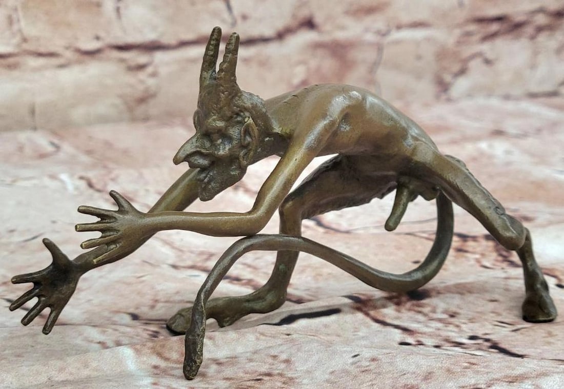 Grotesque Bronze Demon Satyr Figurine – 3.5" x 5.5": Grotesque Bronze Demon Satyr Figurine – 3.5" x 5.5" This bronze figurine depicts a horned satyr in a grotesque, mythological style. The figure is crafted using the lost wax method and finish