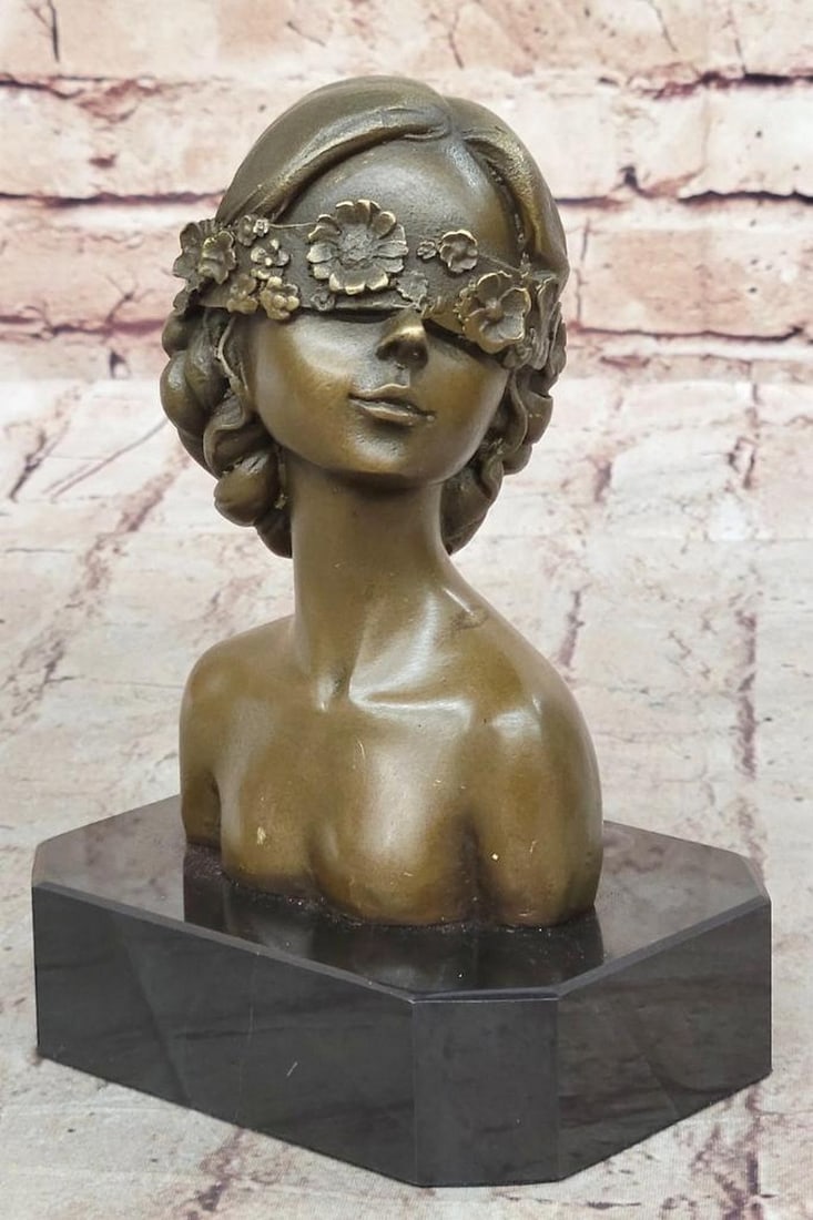 Women Wearing Floral Blindfold Inspired Bronze Statue - 7" x 5": Women Wearing Floral Blindfold Inspired Bronze Statue - 7" x 5" The bronze statue depicted in the image is a bust of a person with shoulder-length hair, embellished with floral motifs. The fi