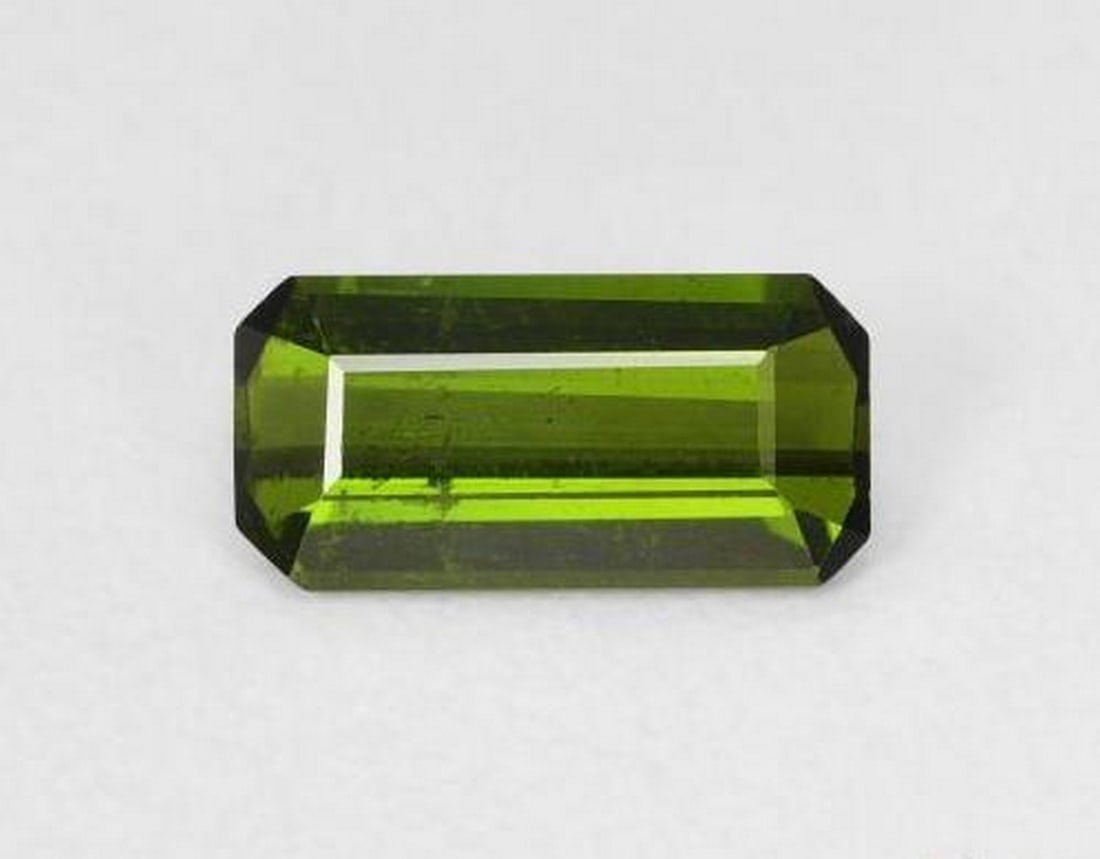 0.78 ct Natural Yellowish Green Tourmaline, Octagon/Emerald Cut, VS, Mozambique: 0.78 ct Natural Yellowish Green Tourmaline, Octagon/Emerald Cut, VS, Mozambique Natural tourmaline gemstone weighing 0.78 carats, cut in an octagon step (emerald) shape with a yellowish green color. T