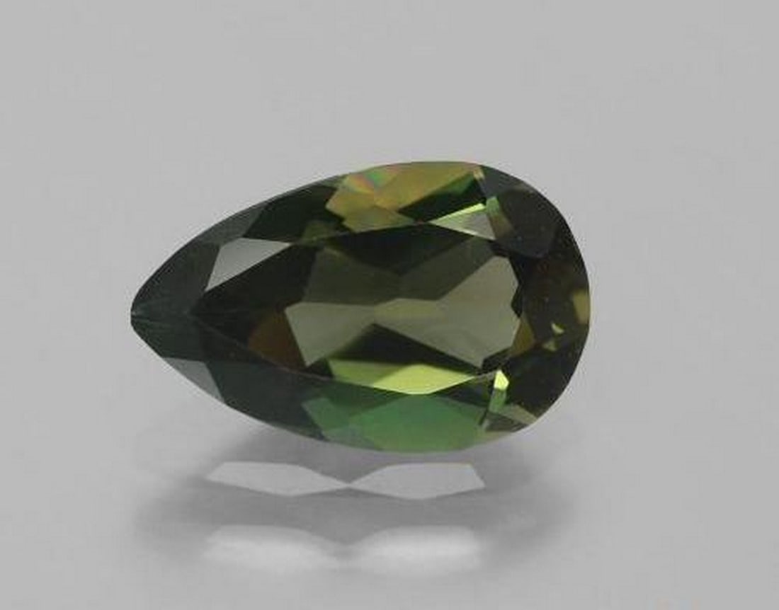 1.42 ct Natural Greenish Brown Kornerupine, Pear Cut, VVS, Sri Lanka: 1.42 ct Natural Greenish Brown Kornerupine, Pear Cut, VVS, Sri Lanka Natural kornerupine gemstone weighing 1.42 carats, cut in a pear facet shape with a greenish brown color. The gem measures 9.55 x 6