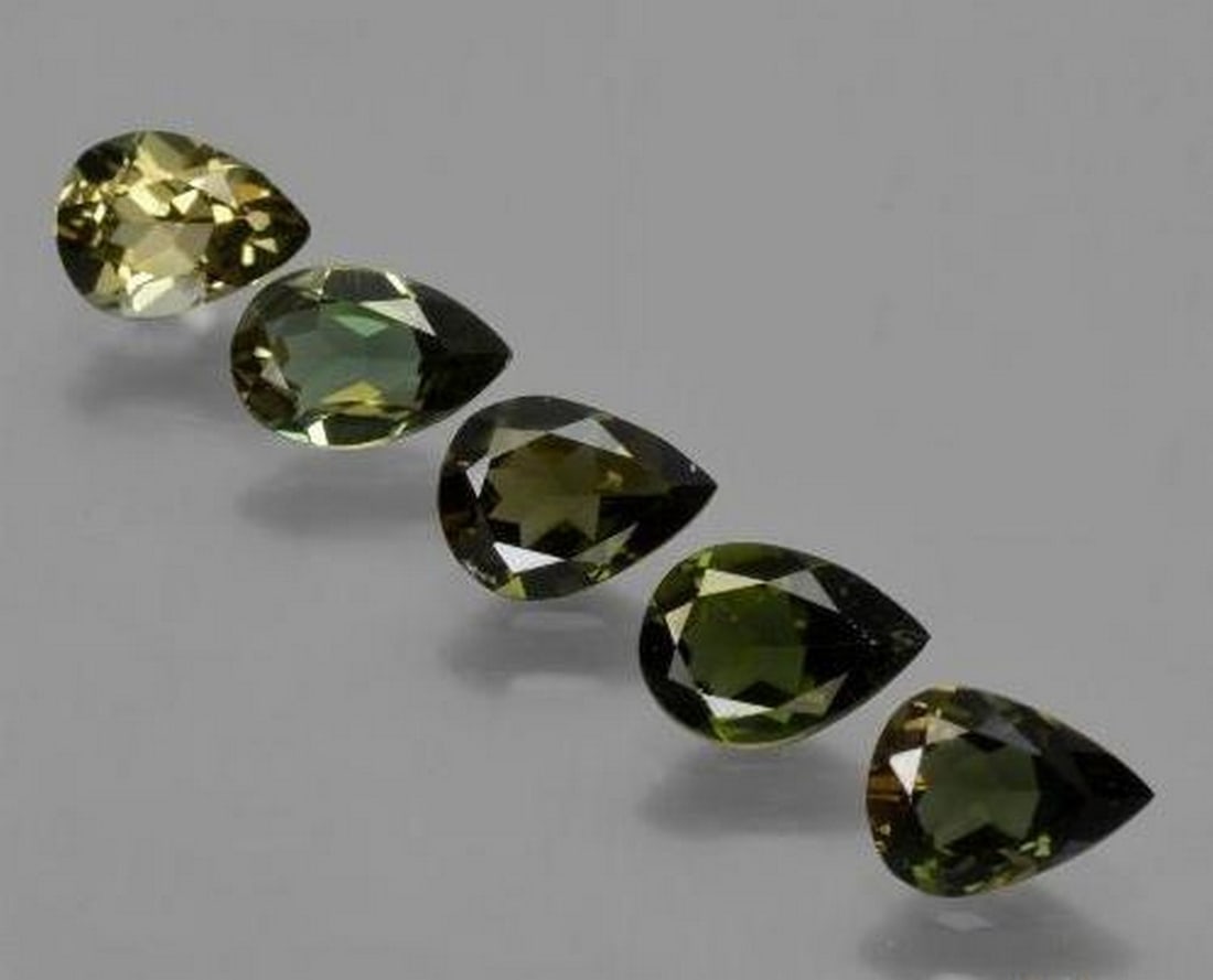 2.34 ctw Natural Dark Green Kornerupine, Pear Cut, VVS–VS, Sri Lanka: 2.34 ctw Natural Dark Green Kornerupine, Pear Cut, VVS–VS, Sri Lanka Set of five natural kornerupine gemstones with a combined weight of 2.34 carats (average 0.47 carats each), cut in pear facet sha