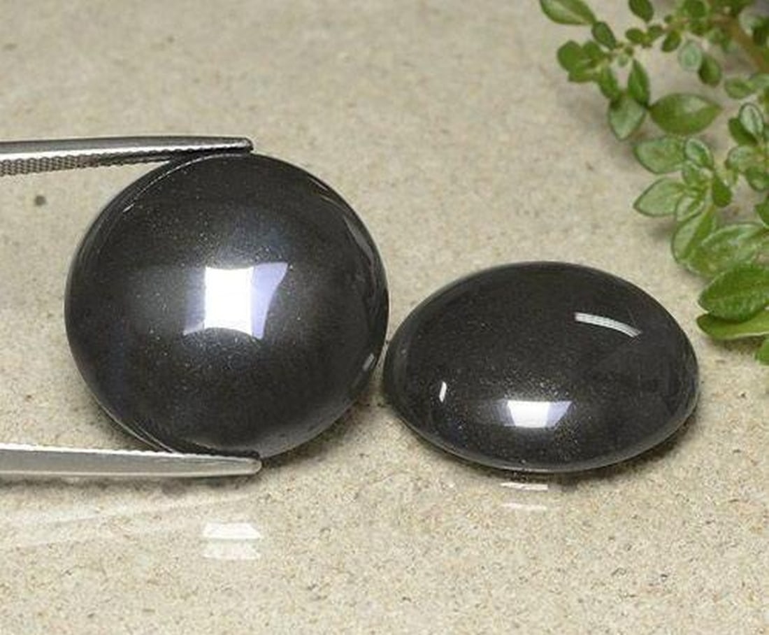 80.74 ct Natural Black Gray Hematite, Round Cabochon, Opaque, Brazil: 80.74 ct Natural Black Gray Hematite, Round Cabochon, Opaque, Brazil Pair of natural hematite gemstones with a total weight of 80.74 ct (average 40.37 ct each), cut in round cabochon shape with a blac