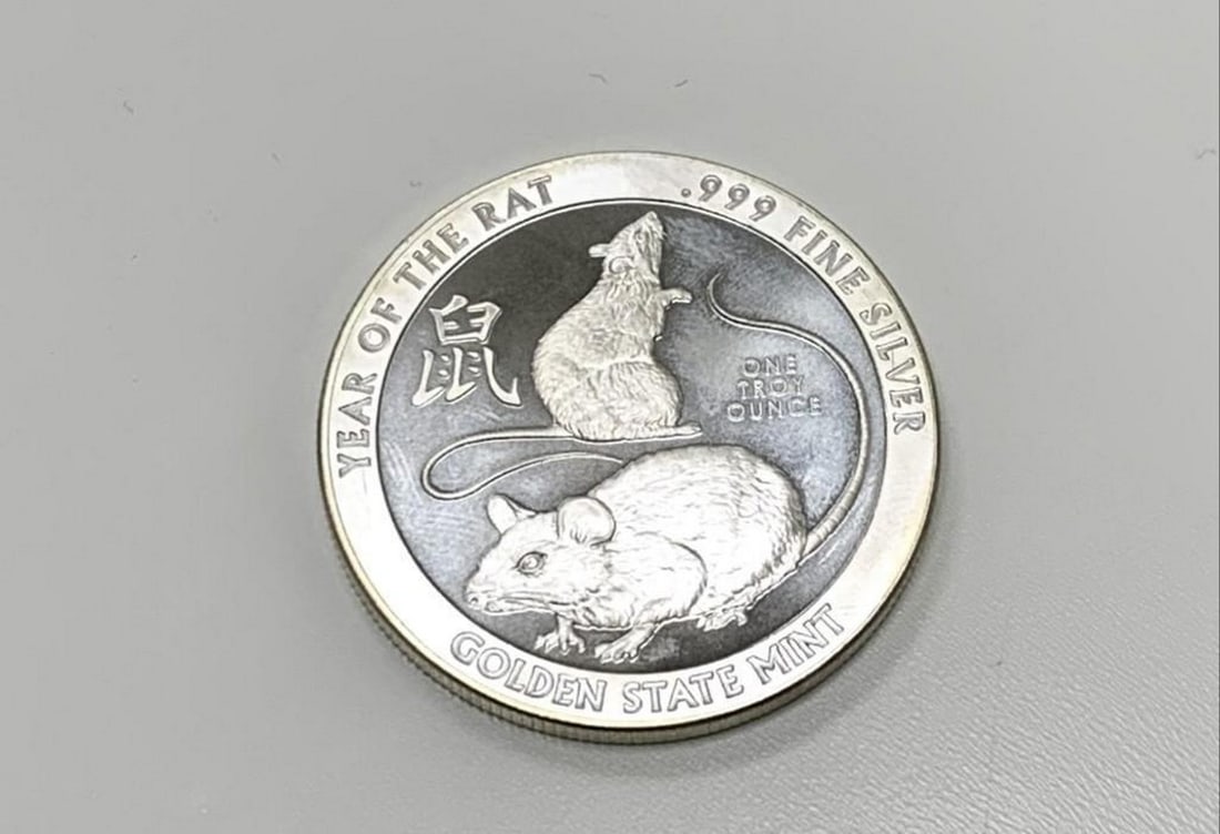 One Troy Ounce .999 Fine Silver Zodiac Coin: One Troy Ounce .999 Fine Silver Zodiac Coin Depicting The Year of the Rat View Photos for Further Details.
