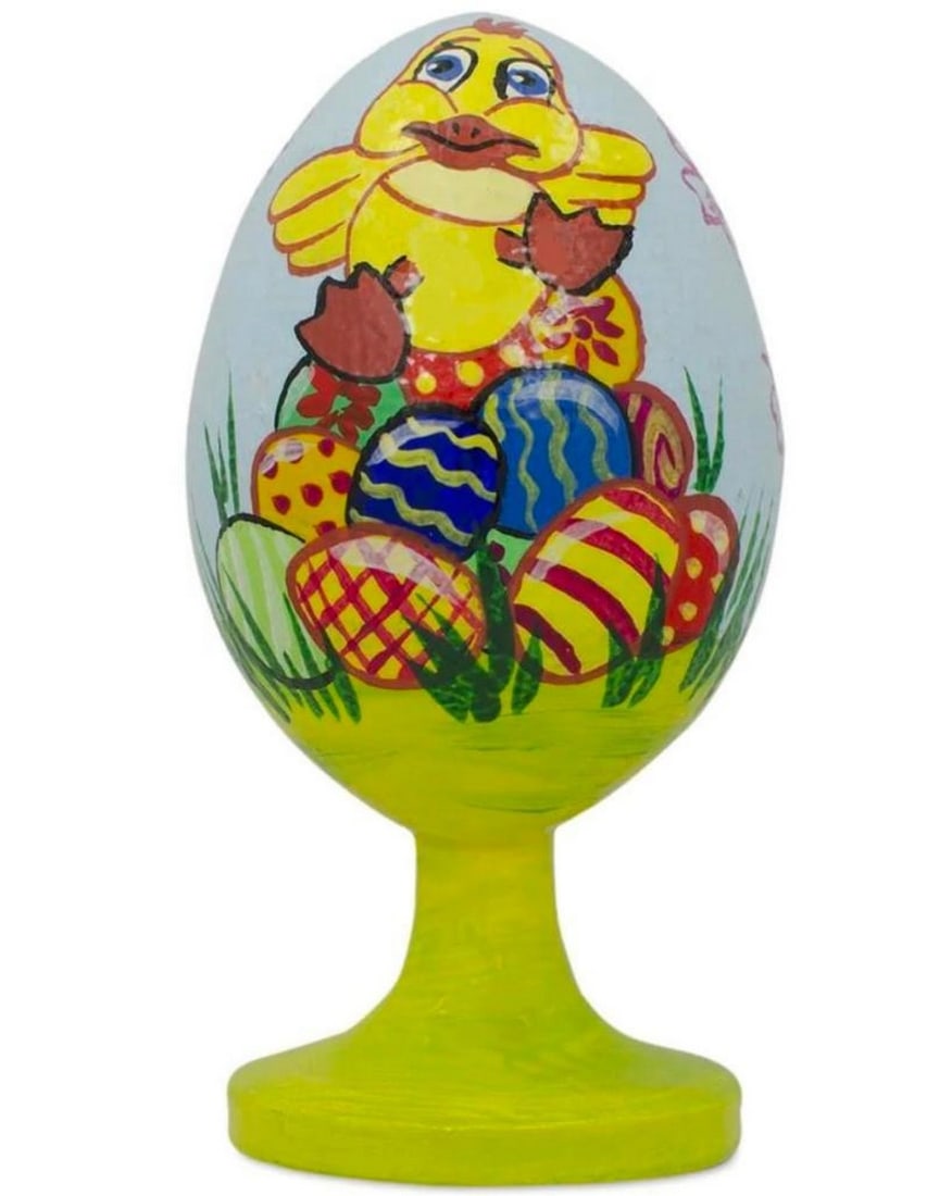 Darling Duckling Easter Egg Wooden Figurine: Darling Ducking Easter Egg Wooden Figurine This figurine displays a beloved ducking sitting on top a pile of beautiful colored Easter eggs. This egg is 3.5 inches tall, hand painted, and has an
