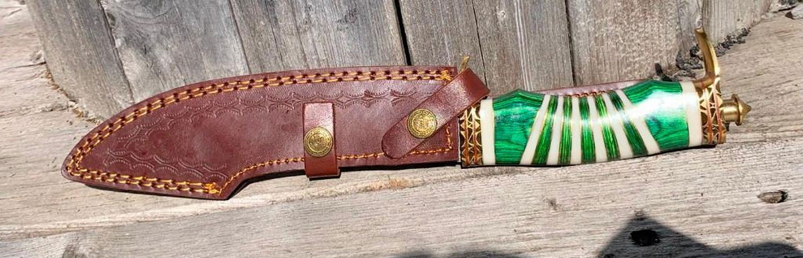 S Curve Inlaid Ribband Handled Damascus Steel Knife: S Curve Inlaid Ribband Handled Damascus Steel Knife Damascus Steel Blade with 256 Layers on it. HARDNESS 56-60 H R C VERY HIGH QUALITY GENUINE LEATHER SHEATH View Photos for Further Details.