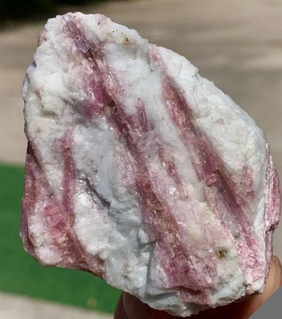 Red Tourmaline with Quartz Crystal Cluster: Red Tourmaline with Quartz Crystal Cluster This 170 gram specimen showcases vivid red tourmaline crystals embedded in a matrix of translucent quartz, creating a striking contrast of color and