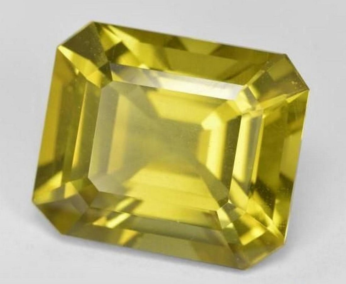 13.92 ct Natural Light Yellow Apatite, Octagon Step Cut, VS, Madagascar: 13.92 ct Natural Light Yellow Apatite, Octagon Step Cut, VS, Madagascar Natural apatite gemstone weighing 13.92 carats, cut in an octagon step (emerald) cut shape with light yellow color. The gem mea