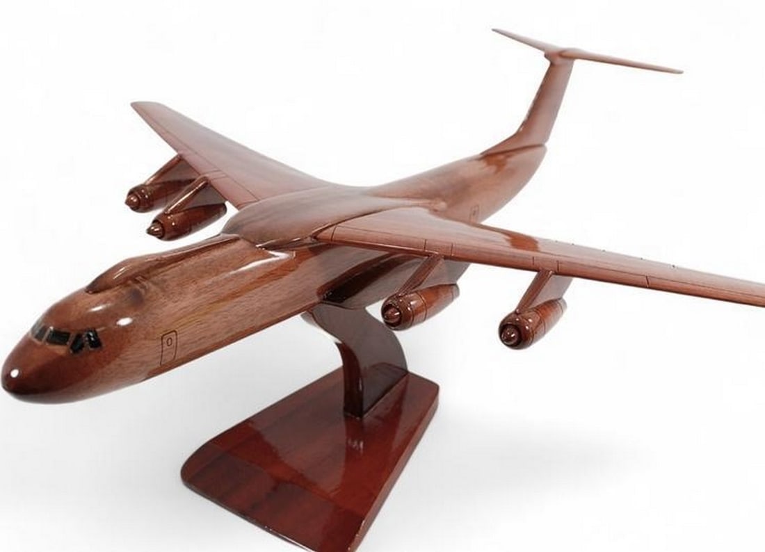 C-141 Starlifter Wooden Model: C-141 Starlifter Wooden Model A true workhorse of the US Air Force, the C-141 troop transport is meticulously handcrafted from solid mahogany, showcasing intricate detailing. The high-gloss finish enh
