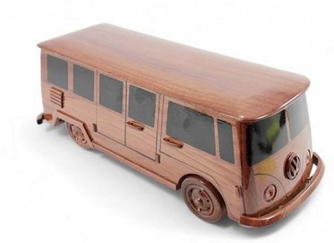 VW Bus: VW Bus The classic VW Bus is wonderfully replicated in this solid mahogany scale model. Movable wheels, finely detailed molding and seam details, make this model a great gift or conversation