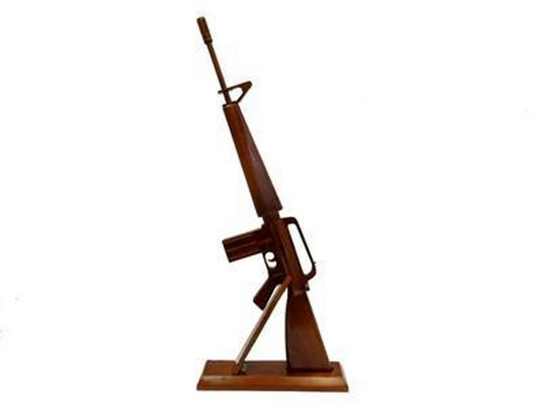 Wooden M-16 Gun Replica: Wooden M-16 Gun Replica Completely handcrafted by our highly skilled craftsmen. If you are looking for that Very Special Gift or Award, this is it! There are only a very few of these worldwide!
