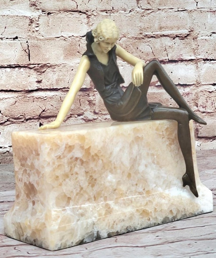 Flapper Girl Modeling on Marble Base Inspired Bronze Statue - 8" x 8": Flapper Girl Modeling on Marble Base Inspired Bronze Statue - 8" x 8" This bronze sculpture captures the essence of a young woman radiating confidence and allure. Dressed in a short, tight m