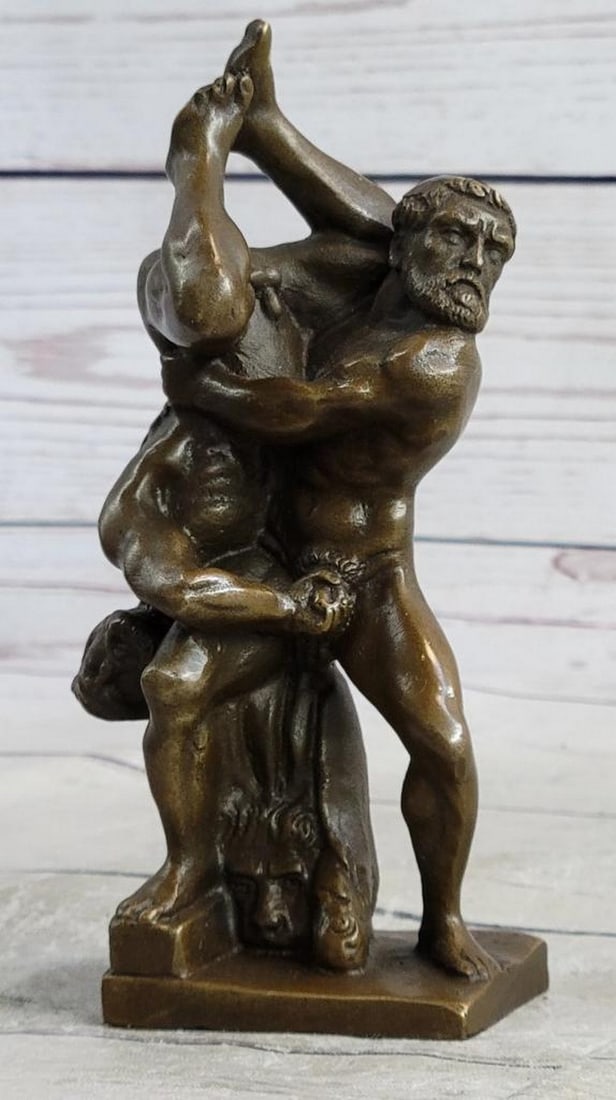 Handmade Wrestling Bronze Figurine – 6" x 2": Handmade Wrestling Bronze Figurine – 6" x 2" This reproduction bronze sculpture powerfully captures the intensity of physical struggle, depicting two bearded wrestlers locked in a dramatic c