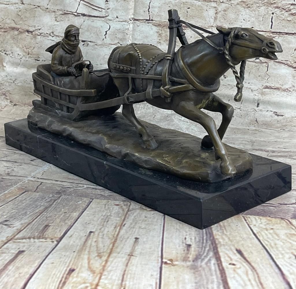 Large Horse-Drawn Sleigh Bronze Sculpture – 15" x 8": Large Horse-Drawn Sleigh Bronze Sculpture – 15" x 8" This reproduction bronze sculpture captures the timeless charm of a winter sleigh ride, depicting a man seated in a sleigh pulled by a po