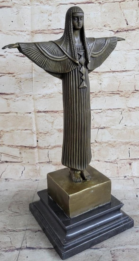 Egyptian Princess Bronze Marble Sculpture: Egyptian Princess Bronze Marble Sculpture This is a beautiful sculpture of an Egyptian woman dancer. Her feet and legs placed together and her arms stretched out and she has on an intricately