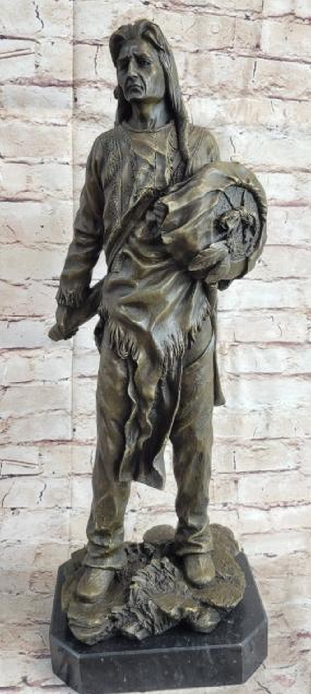 Indian Chief With Shield & Gun Bronze Sculpture: Indian Chief With Shield & Gun Bronze Sculpture This impressionistic sculpture of the Indian chief instills a since of pride, respect, and honor. He has a traditional necklace. His ha