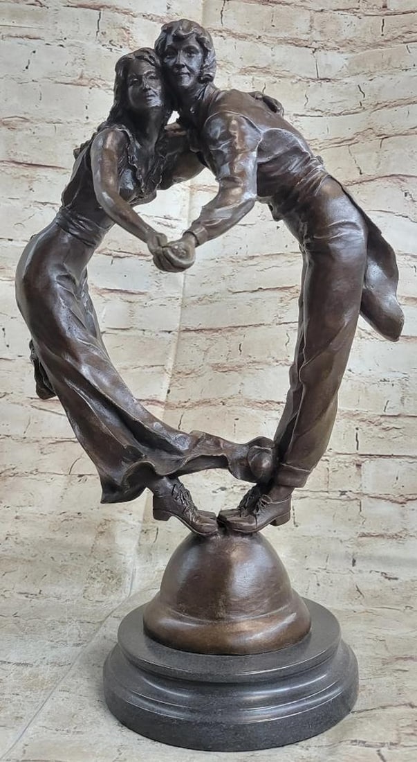 17" Tall Bronze Art Deco Inspired Sculpture Of Couple Dancing - 15lbs: This is an exquisitely detailed bronze statue of a couple dancing would go lovely in any room or your house. They hold each others hands as they keep their heads together real tight. The dress she has
