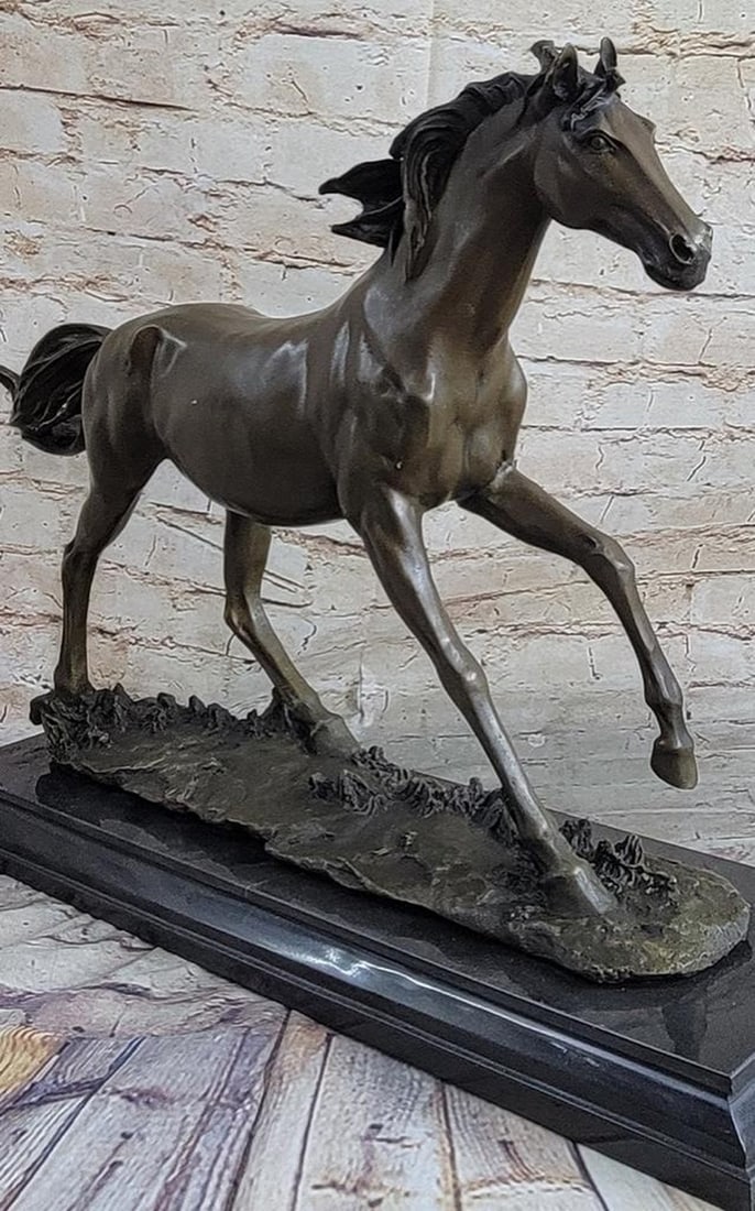 Galloping Stallion Horse Bronze Statue: Galloping Stallion Horse Bronze Statue A feral horse stands solemnly in the valley. He is calm. It`s hair is quite long indicating his untamed state. The body of the horse is lean. This simple sc