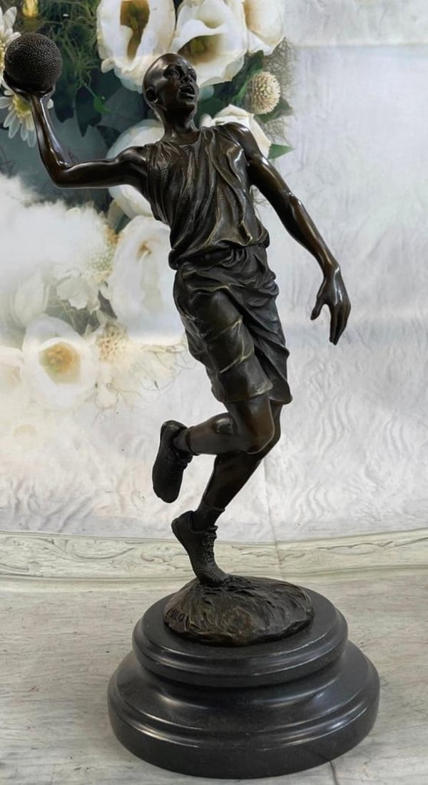 Micheal Jordan Tribute Signed Milo Bronze Sculpture: Micheal Jordan Tribute Signed Milo Bronze Sculpture He is a legend on the court. This basketball player tumbles down the court. As he nears the 3-point line, he holds the ball in his large palm and p