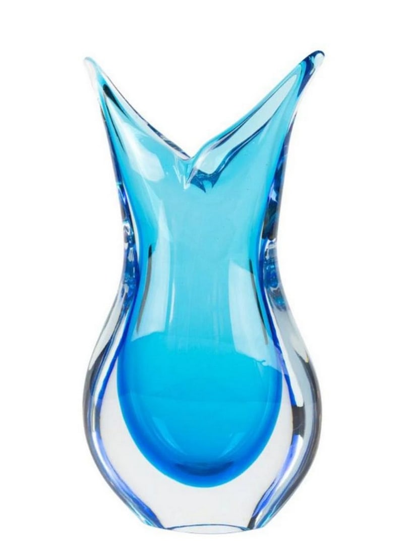 Swallowtail Vase – Cyan Sommerso Murano Glass: Swallowtail Vase – Cyan Sommerso Murano Glass This luxury Murano glass vase is handcrafted using the Sommerso technique, where a layer of cyan glass is covered with a layer of crystal and then blown