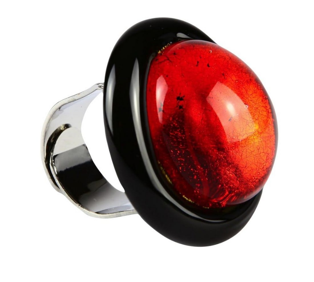 Submerged Red Murano Glass Ring: Submerged Red Murano Glass Ring Glass ring crafted with submerged hot modeling and accented with silver leaf details. Made from Venetian glass with an adjustable band to fit any finger size. Dimensi